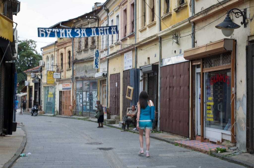 A woman walking past the old bazaar in Bitola, North Macedonia