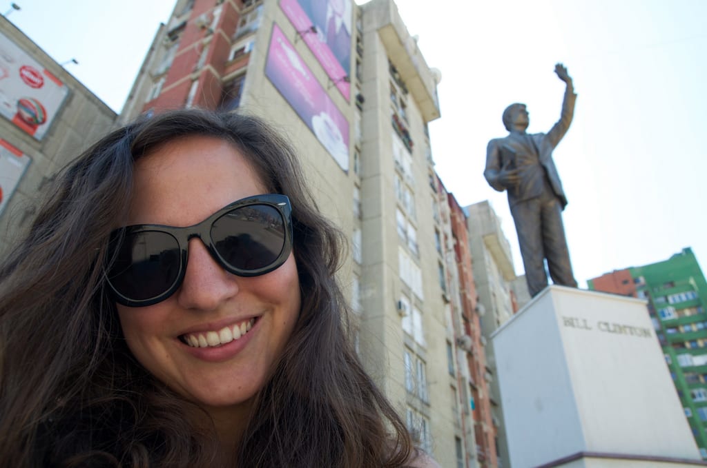 Kate takes a selfie at the Bill Clinton statue in Kosovo.