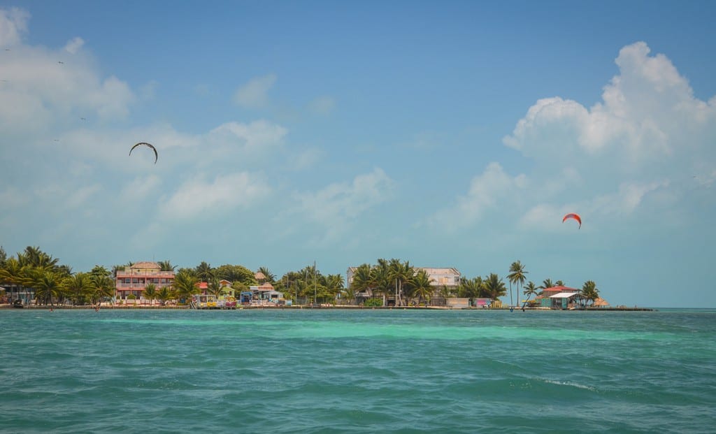 Caye Caulker island fro a distance, a kite in the air.