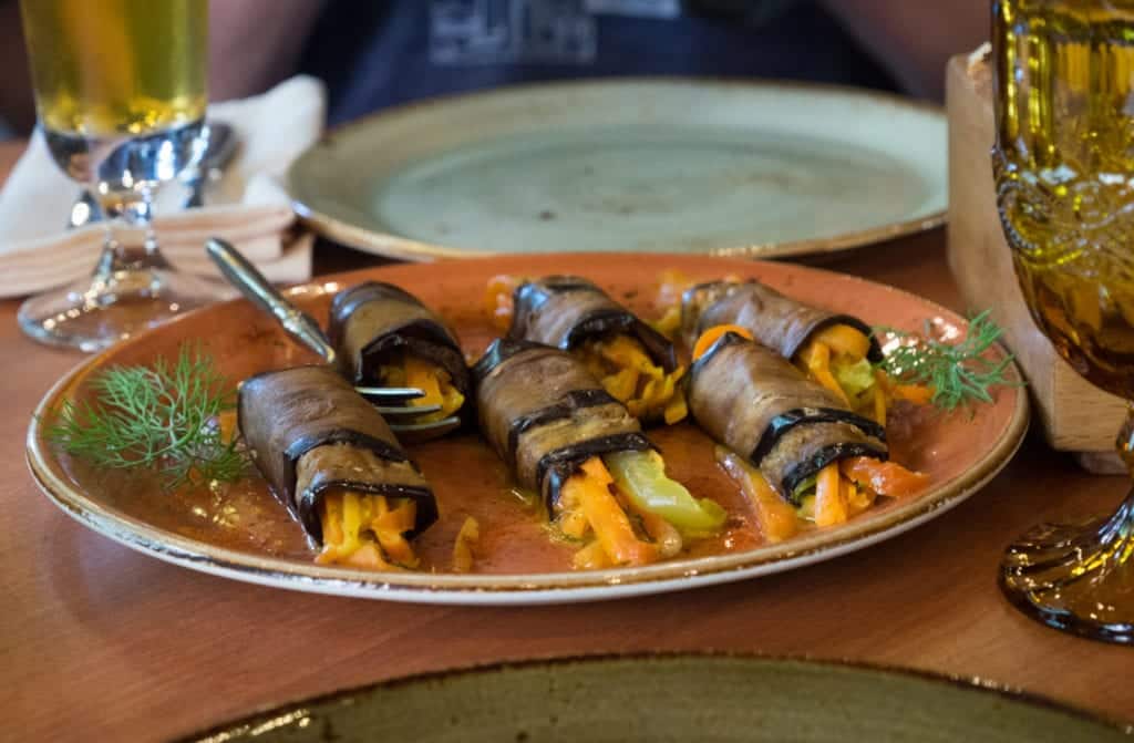 Rolled slices of eggplant stuffed with carrots and other vegetables.