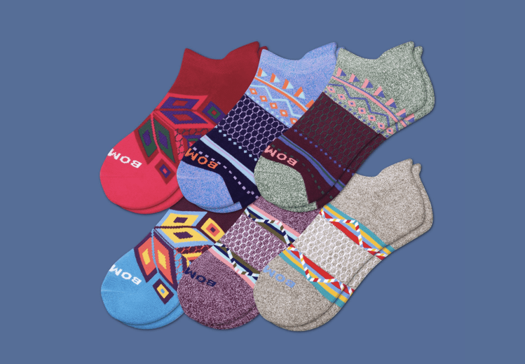 Six pairs of colorful Bombas ankle socks.