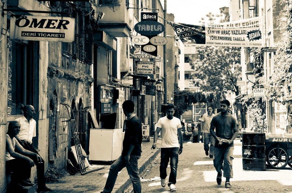 Men walking down a busy street in Istanbul.